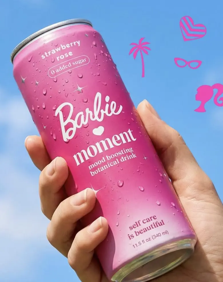 Moment drink can held up against a blue sky